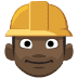 👷🏿 construction worker: dark skin tone display on Facebook